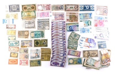 A collection of mixed banknotes, comprising Bank or Ireland, German zen, Portuguese peso, Chinese banknotes, Swiss banknotes, Hong Kong dollars, Czech francs, NGZ test notes, Australian dollars, Zimbabwean dollars, etc. (a quantity)