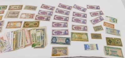 A collection of mixed banknotes, comprising Bank or Ireland, German zen, Portuguese peso, Chinese banknotes, Swiss banknotes, Hong Kong dollars, Czech francs, NGZ test notes, Australian dollars, Zimbabwean dollars, etc. (a quantity) - 3