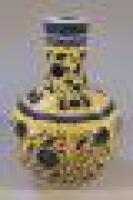 A Chinese export bottle vase decorated with yellow ground enamels