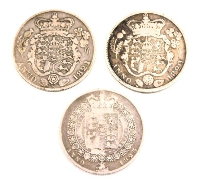 Three George III silver half crowns, comprising 1820, 1823 and 1821, 40.6g all in. (3)