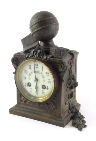 A 19thC bronzed spelter mantel clock, mounted with a globe with a painted dial, 25cm high.