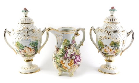 A pair of Capodimonte two handled urns and covers, decorated in relief with putti, 37cm high, and a similar jug.