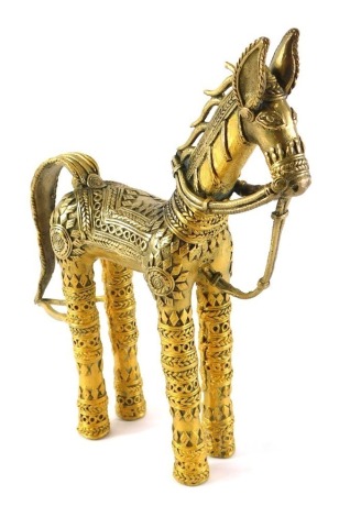 A brass tribal figure of a horse, decorated with geometric bands, etc., 26cm high.