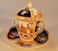 A continental porcelain chocolate cup and saucer dish with pierced gallery holder