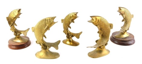 Five similar gilt brass leaping salmon figures, two mounted onto bases, 21cm high.