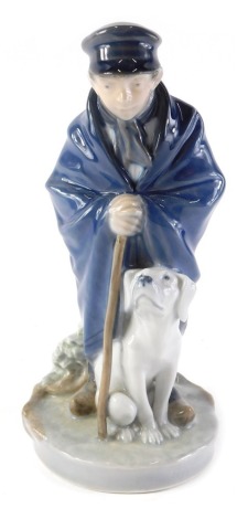 A Royal Copenhagen porcelain figure of a shepherd with dog, numbered 782 by Christian Thomsen, 19cm high.