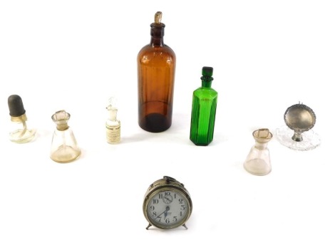 Miscellaneous items, to include a brown chemist bottle, smaller green example, a West Clox Baby Ben alarm clock, an early 20thC cut glass and silver mounted pocket watch stand, etc.