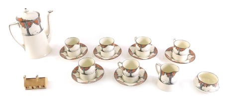 A Crown Ducal Orange Blossom part coffee service, to include six coffee cans, saucers, milk jug, sugar bowl, coffee pot, and a Goss Robert Burns cottage.