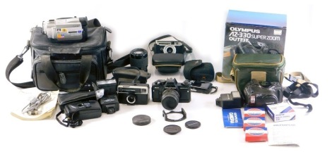 A quantity of camera equipment, to include a Praktica BCA electronic camera with lens, a further Praktica Pentagon lens, Sony camcorder, Olympus camera, etc.