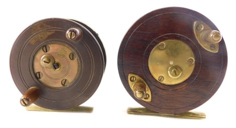 Two similar metal and mahogany fishing reels, each with bone handles, 9cm and 8cm diameter respectively.