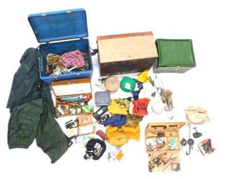 A fishing box containing a collection of fishing accessories, and two other similar boxes.