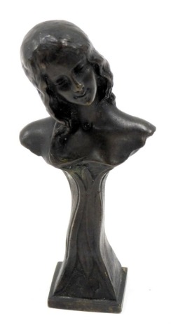 An Art Nouveau bust desk top seal, marked E Beck 02 verso, 11cm high.