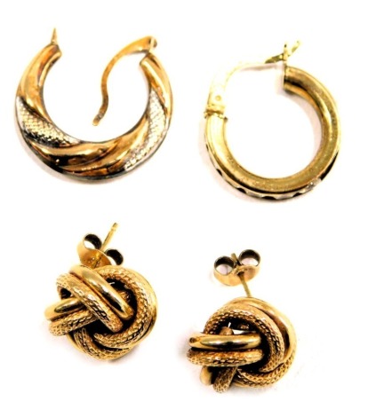 Four earrings, comprising a pair of 9ct gold knot earrings, a bicolour hoop earring, yellow metal stamped 375, and a single paste stone set hoop earring, yellow metal stamped 375, 4.3g all in. (4)