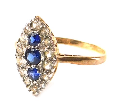 A 9ct gold dress ring, with marquise shaped central decoration set with sapphires and tiny diamonds, in a pave setting, on a raised basket, ring size O½, 1.7g all in.