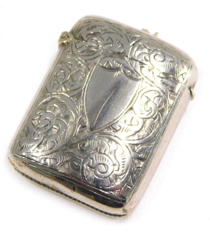 A Victorian silver Vesta case, bright cut engraved with scrolls and vacant shield shaped cartouche, stamped Albo Silver NCR Co, containing some matches, 4.5cm high.