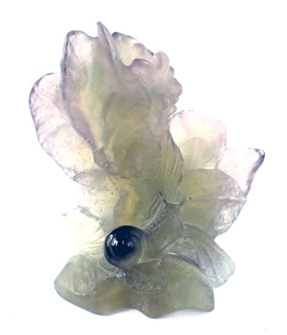 A French Daum Pate de Verre art glass candlestick, modelled as a snail climbing leaves, etched mark to base, Daum France, 13cm high, 10cm wide.