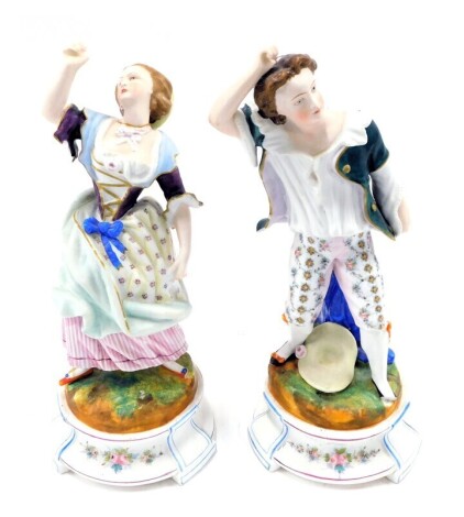 A pair of late 19thC German bisque porcelain figurines, modelled in the form of a gentleman and lady, 36cm high. (AF)