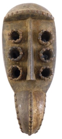 A Grebo (Kru) six eyed spiritual Maou mask, Liberia, approximately 60 years old, 42cm high.