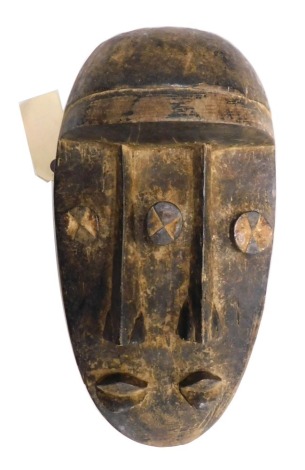 A Grebo (Kru) Janus '2' faced warrior mask, Liberia, approximately 30-40 years old, 35cm high.