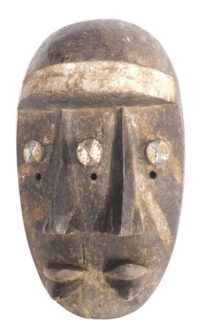 A Grebo (Kru) Janus '2' faced warrior mask, Liberia, approximately 30-40 years old, 34cm high.