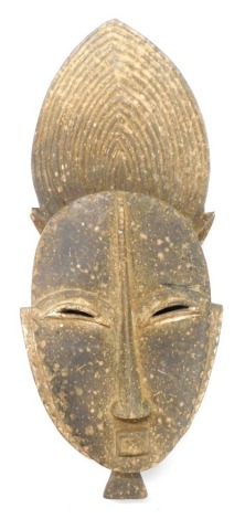 A Baule/Baoule Abstract Mblo portrait mask, Cote D'Ivoire, 43cm high.