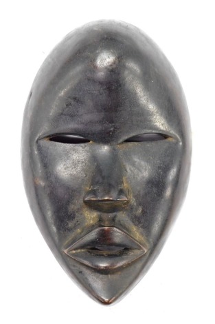 A Dan passport mask, Cote D'Ivoire, 20cm high.