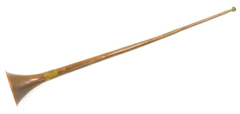 A copper and brass coaching horn, 91cm long.