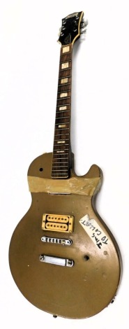 An electric guitar bearing Les Paul Standard and Avon, 100cm long. (AF)