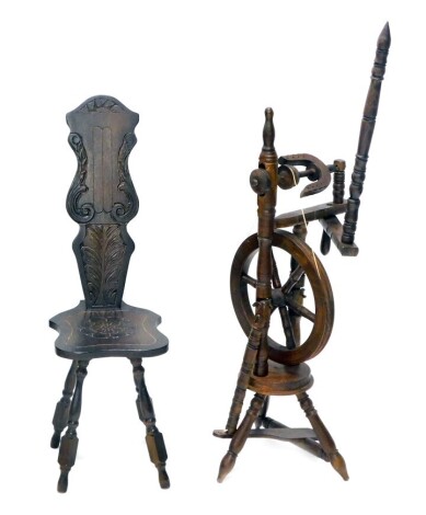 A 20thC spinning wheel and chair. (2)