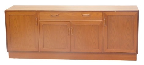 A G Plan teak low sideboard, with an arrangement of single drawer, four doors and plinth base, 72cm high, 187cm wide, 45cm deep.