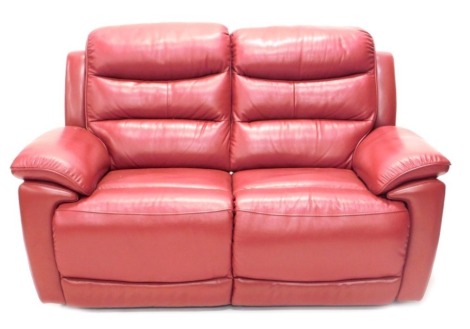 A red leather finish reclining two seater sofa, 170cm wide.