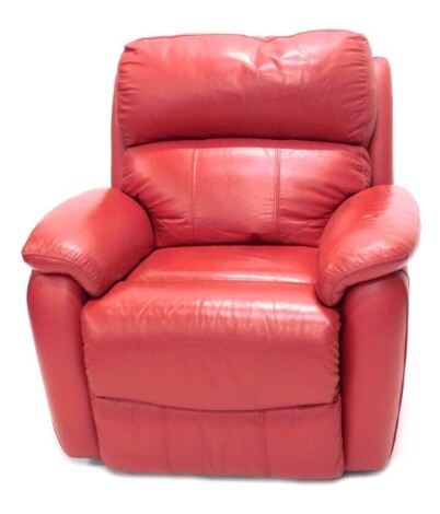 A red leather upholstered electric reclining armchair.