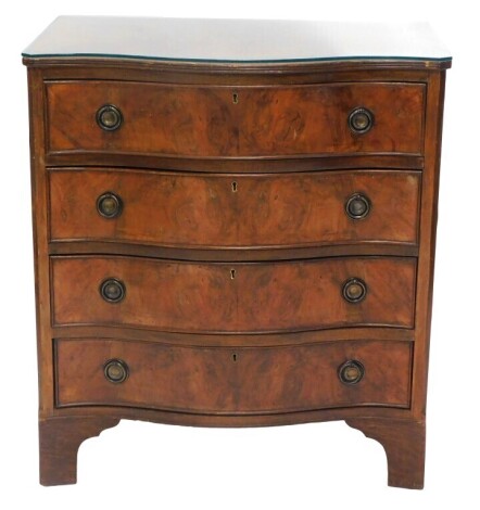 A George III style serpentine walnut chest, of four graduated drawers, with ring handles and bracket feet, 86cm high, 80cm wide, 55cm deep.