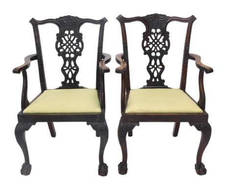 A pair of late Victorian carver chairs, with pierced splat back, in the Chippendale style, 65cm over arms.