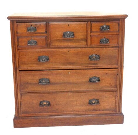 A late Victorian walnut combination chest of drawers, with pressed anodised handles and plinth base, 123cm high, 123cm wide, 54cm deep.