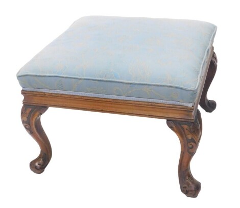 A Victorian walnut stool, with blue floral damask upholstery and carved cabriole legs, 45cm high, 65cm square.