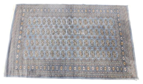 A Bahraki Turkish design blue ground rug, 247cm x 155cm. Provenance: With purchase receipt for G H Shaw Ltd for £280.