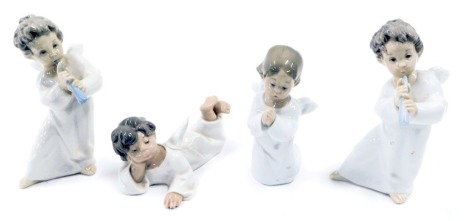 Four Lladro porcelain figures modelled as angels, in various poses, two playing a wind instrument, one lying down and the other kneeling praying, printed marks, the largest 17cm high.