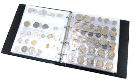 An album containing pre decimal GB and world coinage, to include pre and post 1920 threepence coins, shillings to include some Queen Victoria, brass threepences, commemorative fifty pence coins, Victorian pennies, half crowns, American coinage, 1890 comme