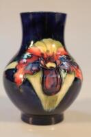 A small Moorcroft vase decorated with the Orchid pattern