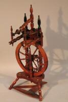 A 19thC small spinning wheel.