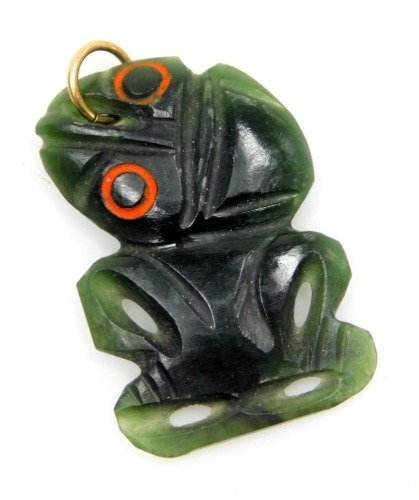 A New Zealand Maori Hei-tiki carved jade pendant, 3cm high.