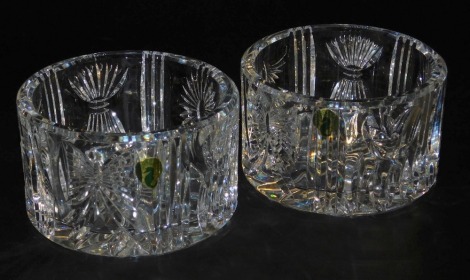 A pair of Waterford Crystal Millennium champagne bottle coasters, 103006, boxed, 13cm diameter.