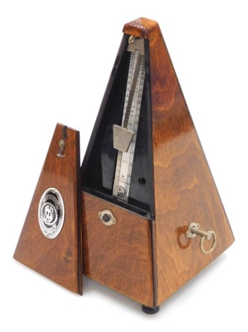 A early 20thC German Maelzel metronome, 23cm high.