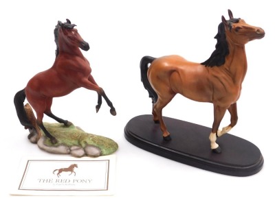 A Beswick matt brown pottery figure of a horse, modelled with its head and front left leg raised, raised on an oval base, 23cm high, together with a Franklyn mint model of The Red Pony, designed by Pamela Du Boulay, with certificate, printed marks. (2)