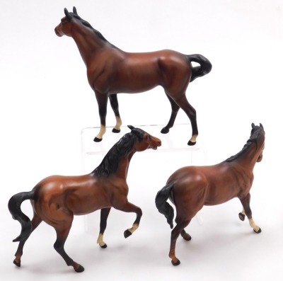 Three Beswick matt brown pottery figures of horses, in various poses, printed marks. - 2