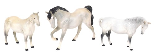 Three Beswick pottery dappled grey models of horses, two gloss, one matt, printed marks.