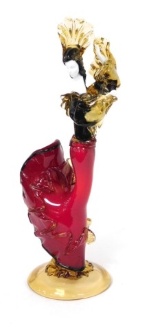 A Murano style glass figure of a Spanish dancing lady, raised on a conical foot, 45cm high.