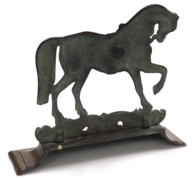 A Victorian brass doorstop, cast as a prancing horse, on a foliate scroll ground, above an outswept base, 30cm wide. - 2