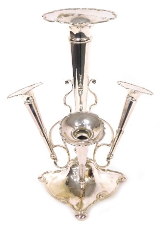 A Victorian silver plated epergne, with a tall central trumpet, flanked by three smaller trumpets, on scrolling supports, above a tri-foot form base, raised on bun feet, 41cm high.